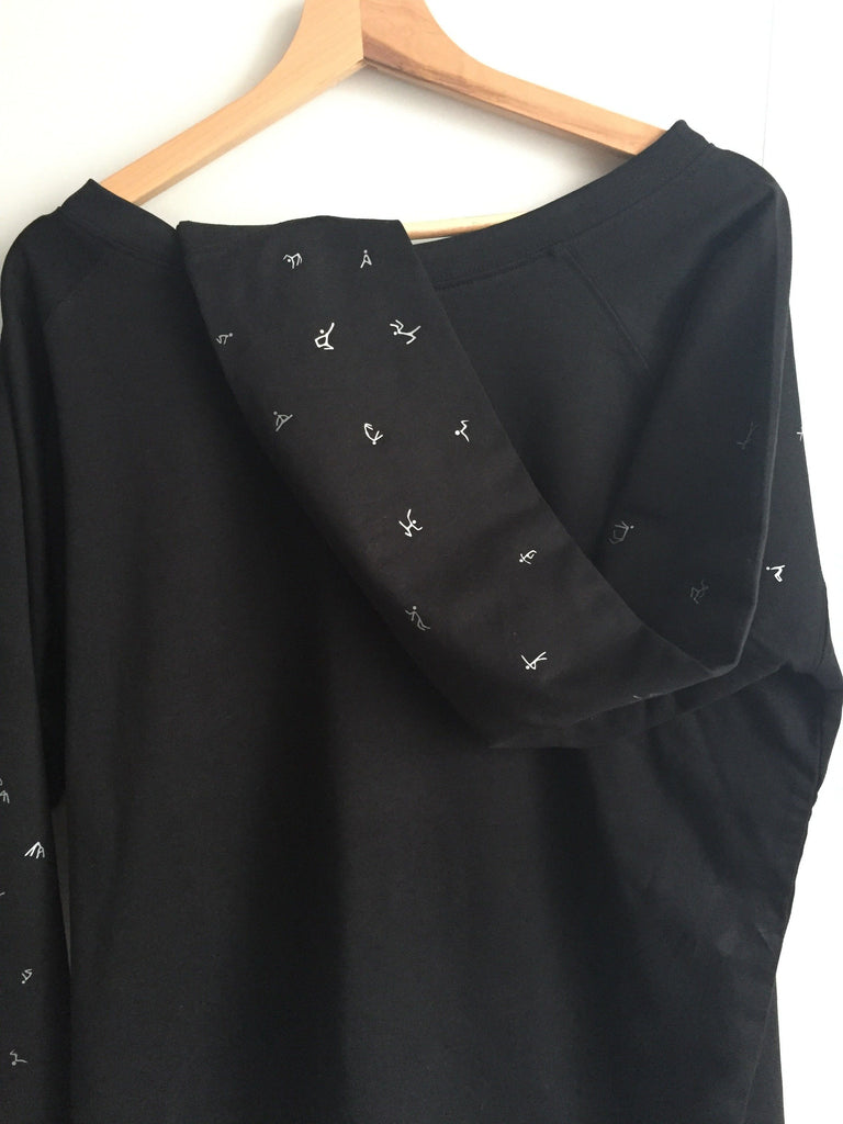 Black women jumper, silver stick figures - off the shoulder style ...